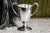 This circa 1930s double-handled trophy is a charming example of early 20th-century decorative silverplate. The trophy is...