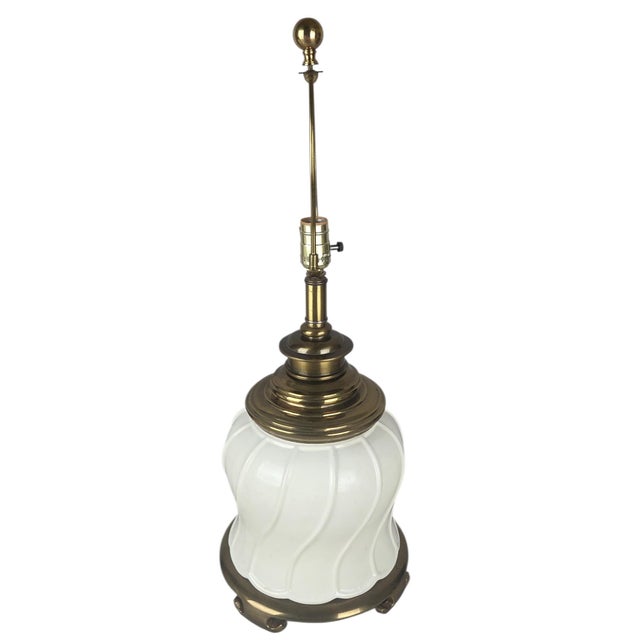 A striking vintage table lamp by Morris Greenspan, featuring a sculptural glossy white ceramic body paired with...