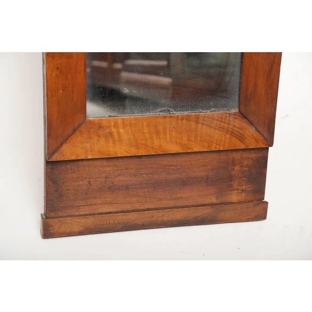 Small period French Empire mahogany trumeau with gilt bronze mounts representing cornucopias, ivy and marguerite flowers....