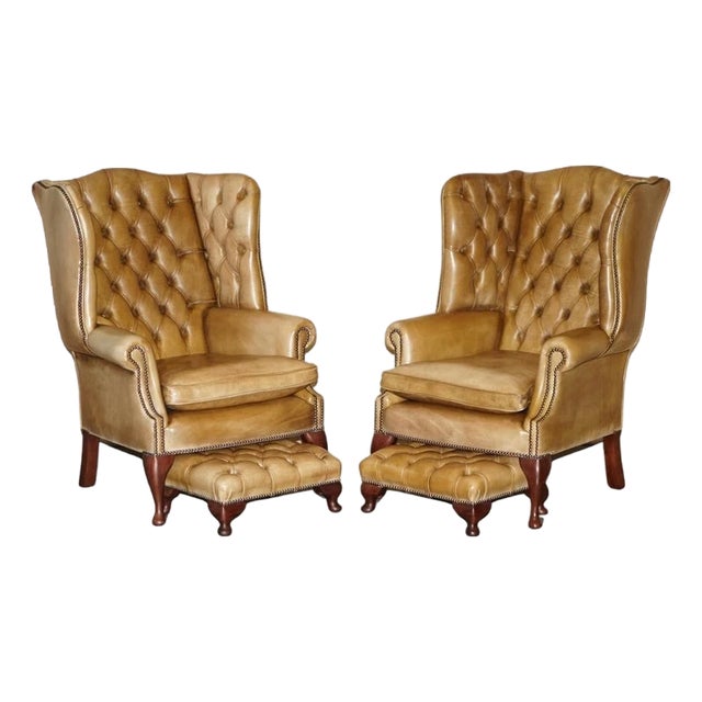Pair of Vintage Tan Brown Leather Chesterfield Wingback Chairs With Footstools For Sale
