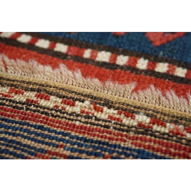 This boldly simple SW Caucasian Armenian scatter shows a uniform patter of octagons enclosing hooked diamonds in both the...