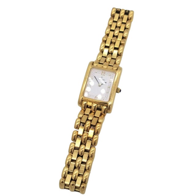 Concord Venetto 18K Gold Ladies Wristwatch with Concord Certifications and weighs 38.5 DWT. The 19mm by 21mm case houses a...