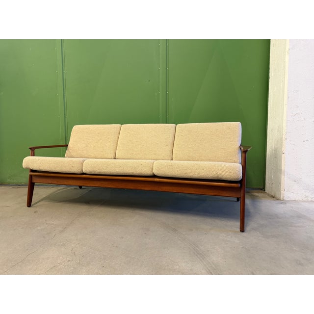 a sofa * 3-seater sofa * Design: Arne Vodder (1926 - 2009) * Manufacturer: Vamo Sonderborg * Arne Vodder studied...