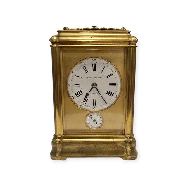 Elegant 19th century Spanish carriage clock in finely cast and gilded bronze, signed by the prestigious Madrid retailer...