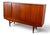 A Danish teak high sideboard by Westergaards Møbelfabrik, with a substantial 71-inch width and an elevated cabinet form....