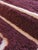 This Burgundy Textured Moroccan Wool Rug, measuring 9.3 by 6.8 feet, brings a warm and inviting touch to any room. Its...