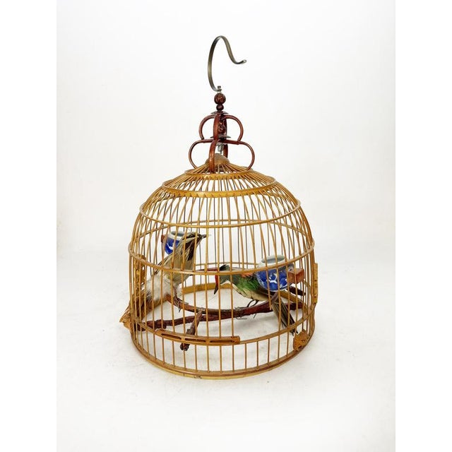 Decorative birdcage made of bamboo and wood, manufactured in China in the 1970s. This elegant vintage Asian birdcage is...