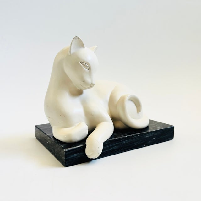 A single vintage art deco style cat bookend from the 1980s. Made of either cast stone or heavy resin with a matte white...