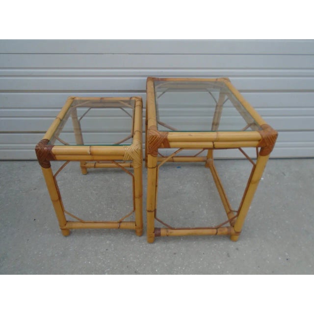 Bring a touch of island elegance to your home with this set of 2 vintage bamboo and rattan nesting end tables, inspired by...
