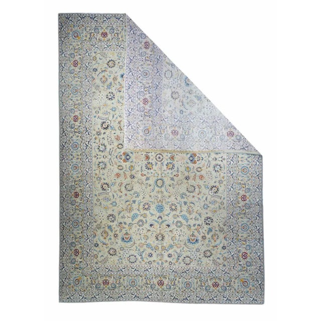 This finely woven central Persian city carpet has successfully taken up the Isfahan palette of lighter blue, cream, beige...