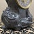 This vintage-inspired mantel clock features an ornate, Rococo-style case with intricate scrollwork and leaf motifs.