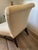 An elegant slipper chair designed by Barbara Barry for Baker Furniture, featuring a gently curved back, generous...