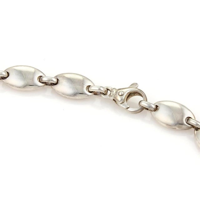 The Tiffany & Co. Sterling Silver Pebbles Oval Link Necklace is a vintage piece of fine jewelry signed by the renowned...