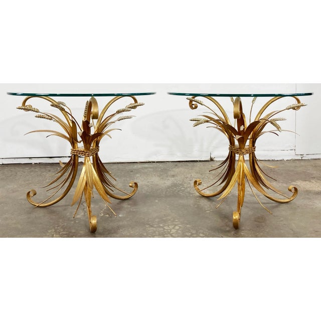 Dress to impress with these statement Italian mid century Hollywood Regency gilt metal sheaf of wheat side tables....