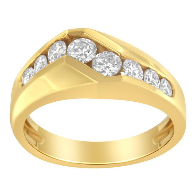 A diamond men's band that is uniquely designed with eight graduated round diamonds set in a Z-form shape along a wide 14...