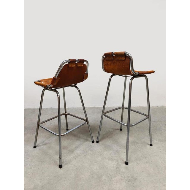 A rare find! This fantastic set of two chrome/leather stools from the 1960s. Both differ slightly in height and style....