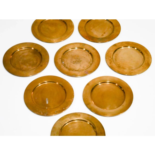 Set of ten coaster dining brass plates produced in mid-Century by Stelton in Denmark. This piece has an attribution mark,...