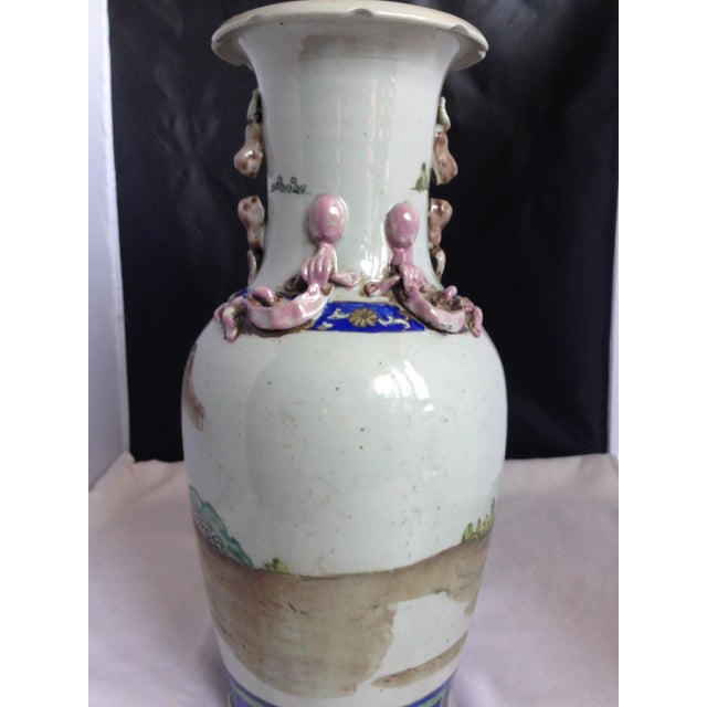 Bring a statement piece of traditional Asian artistry into your home with this striking antique Chinese porcelain vase....