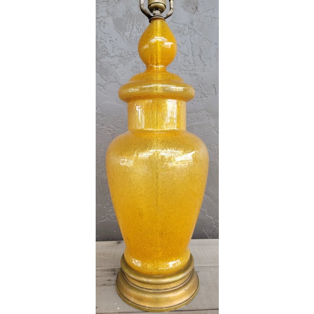 Fine bubble glass table lamps by Wilshire House, Beverly Hills, California. Mounted to wooden base. Original harp and...