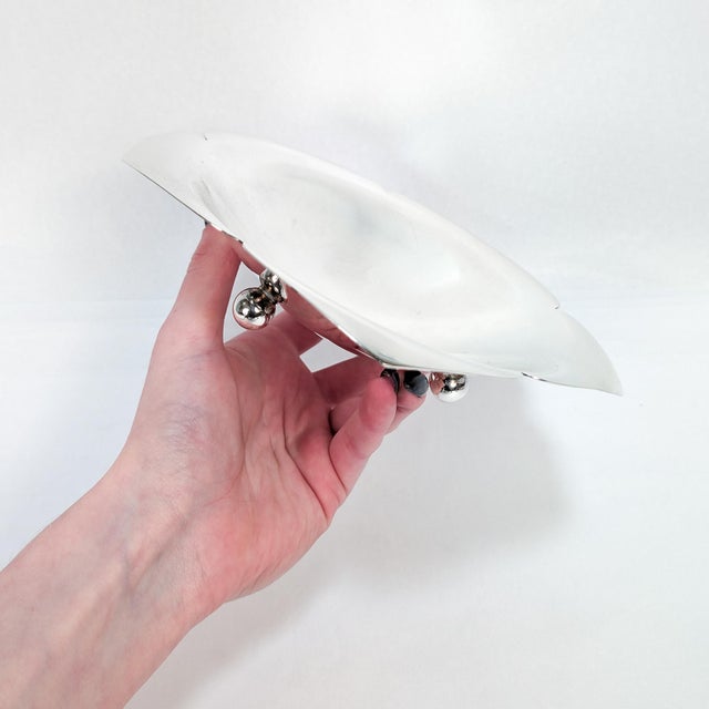 A fine signed vintage silver bowl or vide poche. By Tiffany & Co. In sterling silver. In the form of a 5-petaled flower...