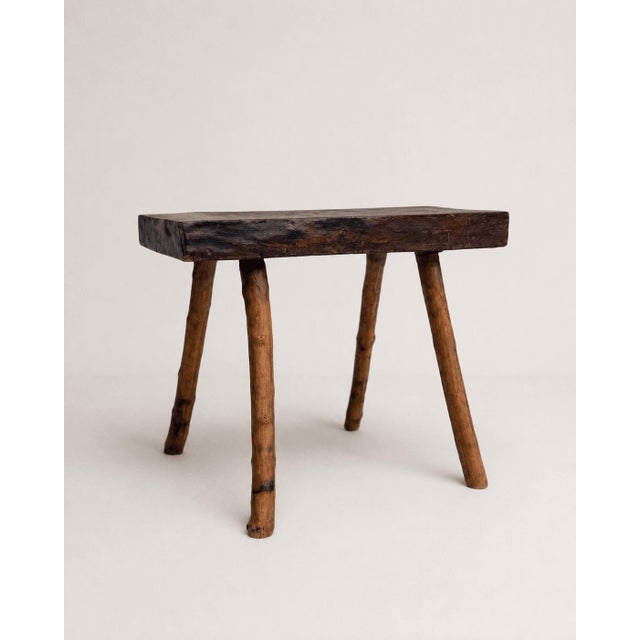 A delightful intersection of organic texture and classic French country flair, this vintage three-legged stool pairs a...