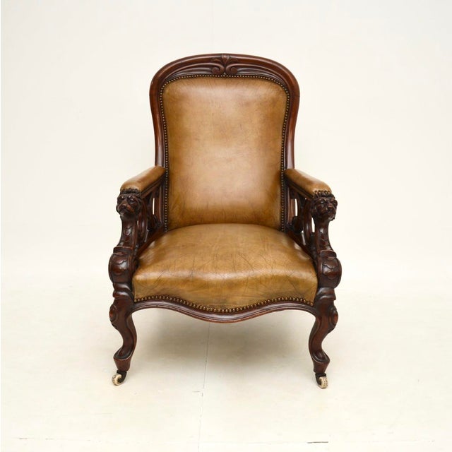 An exceptional antique Victorian carved armchair. This was made in England, it dates from around the 1850-1870 period. The...