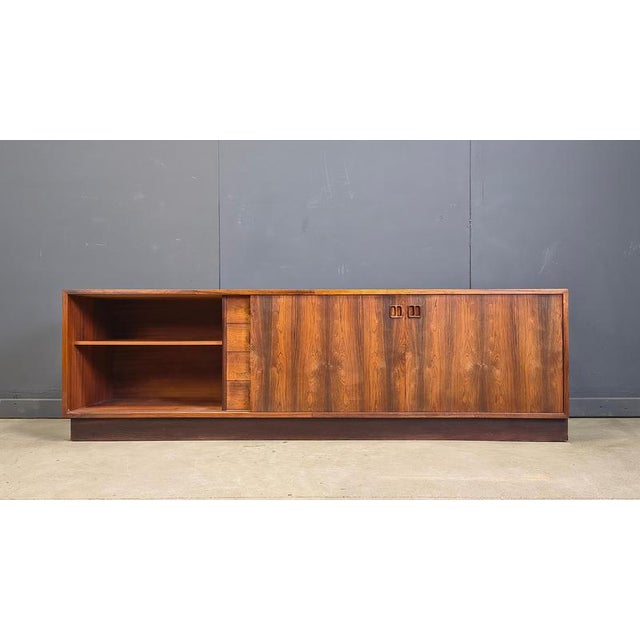 Mid century sideboard designed by Edmund Jorgensen. Great looking high quality piece of scandinavian furniture offering...