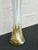 This vintage Italian art glass vase, reminiscent of Murano pieces from the 1960s, features a tall, slender trumpet shape....