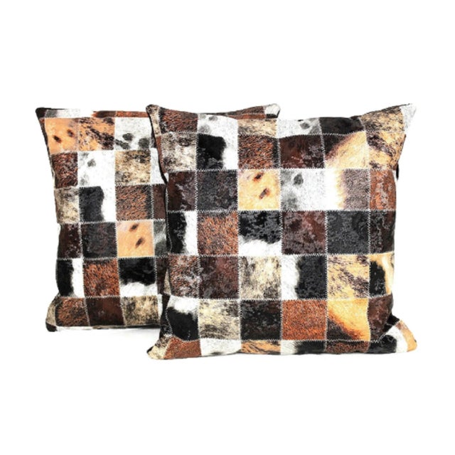 You don't have to sacrifice fun for sophistication with this brown, black and silver cow print throw pillow cover from...