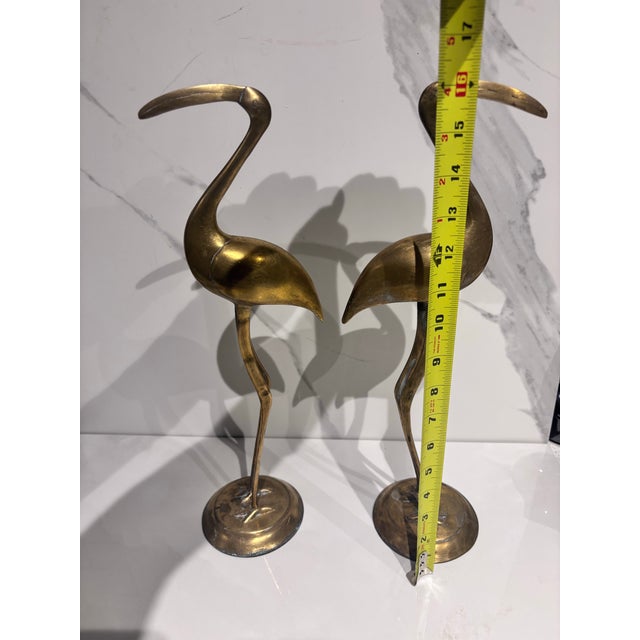 A Pair of Vintage Solid Brass Crane Figurines Standing Gracefully on Round Bases With a Warm, Aged Patina. For Sale In Miami - Image 6 of 12
