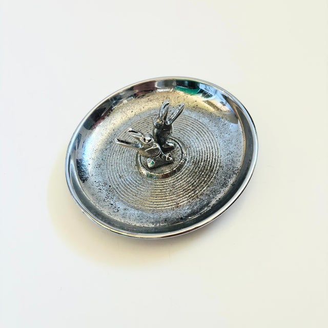 A vintage chrome deco "pincherette" ashtray. Nice circular shape, features 2 small birds in the center for holding...