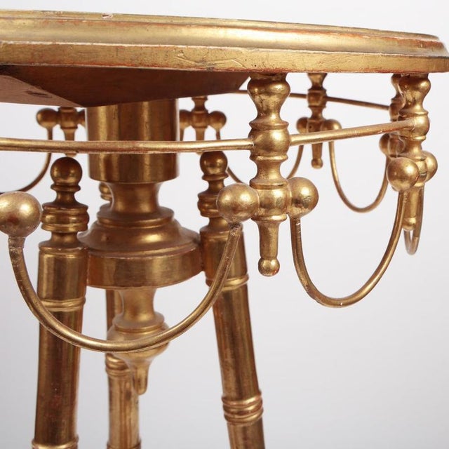 A highly decorative giltwood pedestal table / guridon, executed in the Louis XVI / Neoclassical style, likely French in...