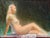 Reclining Nude in Green by Diego Glazer | Oil on canvas panel Nude figure seated against a dark background. For Sale