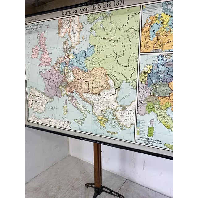 Large Colourful school map of Europe, named "Europe von 1815 bis 1871”. The map is made out of paper on canvas with wooden...