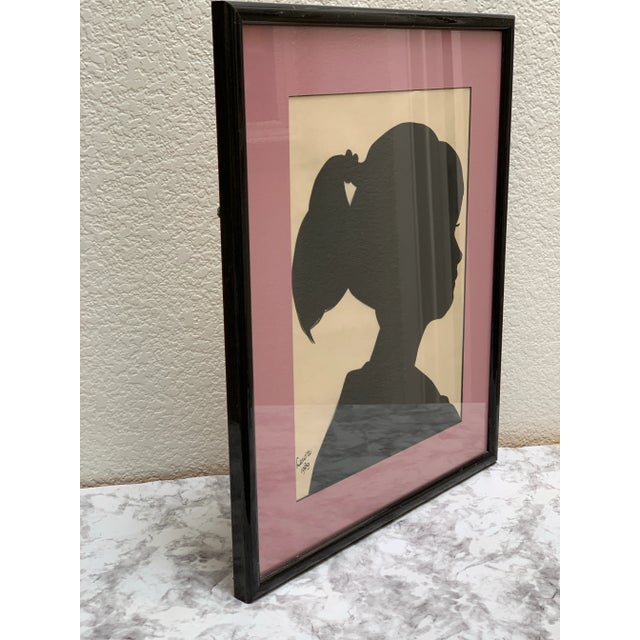 Vintage 1980s shadow silhouette portrait of a young woman. Handcrafted and signed in 1989 and framed.