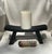 A beautifully austere primitive stool in ebonized wood, acquired at a Paris flea market. The deeply curved saddle seat is...