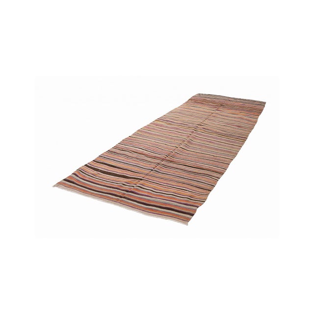 Handwoven vintage striped decorative kilim rug from Denizli region of Turkey. Approximately 50-60 years old. In very good...