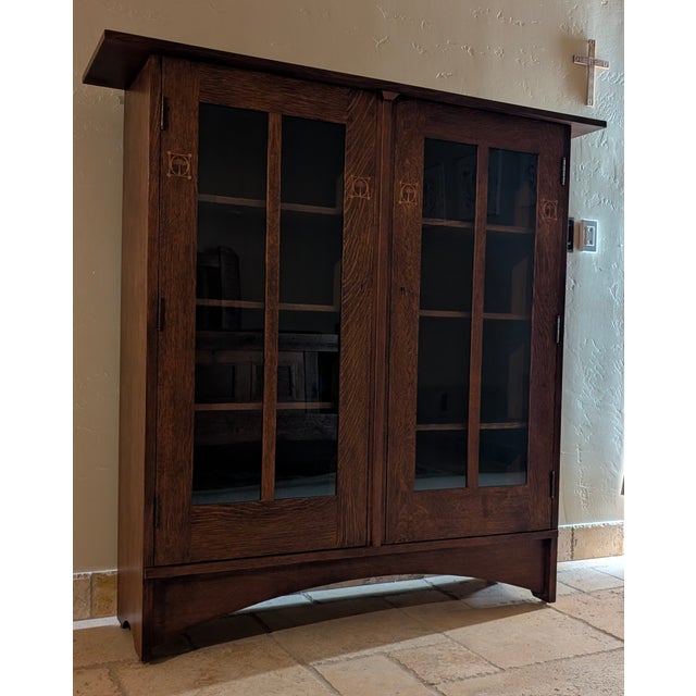 Absolutely stunning Harvey Ellis Bookcase. Signature styling consists of inlays featuring walnut, cherry, oak and maple....