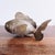 This is a vintage highly collectible handmade Cambodian silver plated copper fish with articulated, movable parts. The...