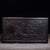 A beautifully crafted Chinese hardwood box, likely made of Zitan wood, featuring deep relief carvings throughout. The lid...