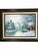 A signed landscape painting depicting a tranquil mountain lake surrounded by snow-covered evergreens, distant alpine...