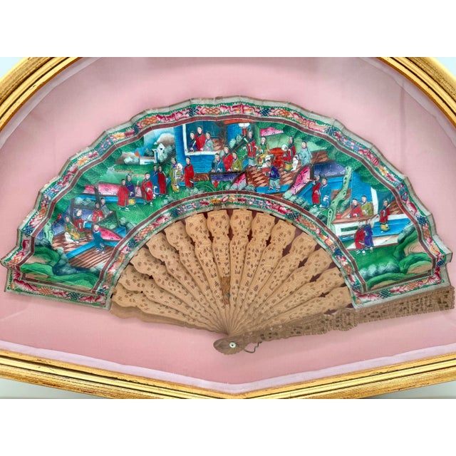 A remarkable example of 19th-century Chinese export artistry, this hand fan was produced in Canton for the European market...