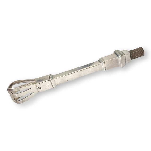 Early 20th century French Art Deco ice tongs by renowned silversmith François Frionnet. Crafted in silverplate with a...