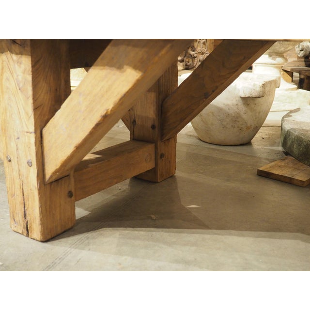 A versatile piece of French furniture, hand-carved in the 1940s in France, this elm wood aviation bench would have been...