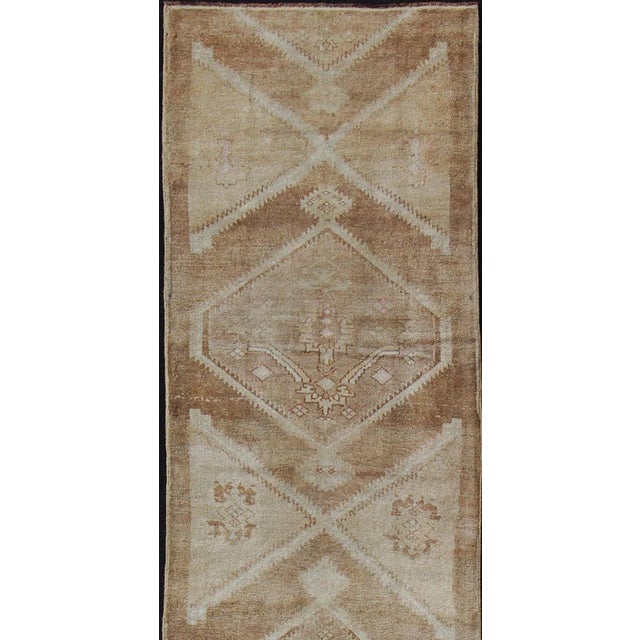 vintage Turkish Oushak runner in neutral colors with medallions in taupe, brown and light brown. Keivan Woven Arts /...