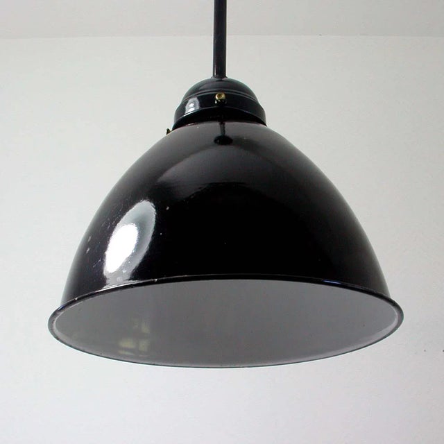 - Vintage industrial ceiling light - Made in Germany in the 1940s to 1950s - The lamp features a black enamel lampshade -...