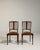 A refined pair of British chairs crafted in mahogany, featuring inlay work that reflects the neoclassical influence...