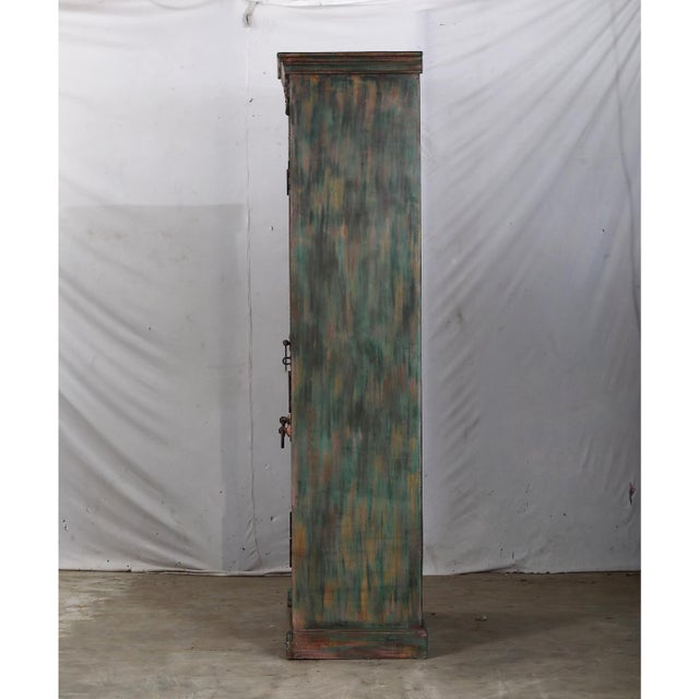 Armoire constructed from outstanding antique painted Indian teakwood interior doors and architectural elements, showcasing...