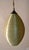 The textured spun fiberglass surface appears to be crystal color, but since the interior is green, it turns florescent...