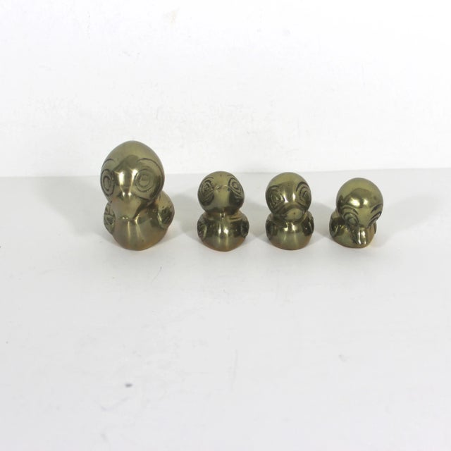 Set of Mid Century brass duck figurines. There is a mother duck with three smaller ducklings. Rich patina and nice detail....